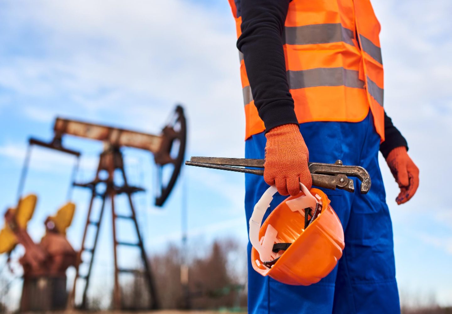 oil-worker-orange-uniform-helmet-background-pump-jack-blue-sky